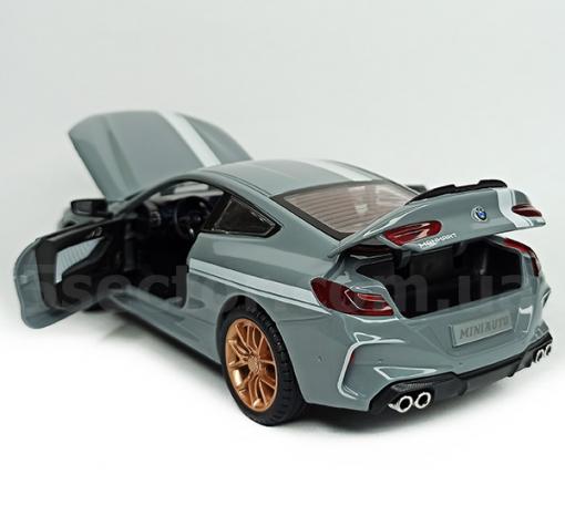 Метална кола с отварящи се врати капаци светлини и звуци BMW M8 Competition Manhart 1:24 - сива — снимка 3