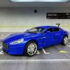 Метална кола с отварящи се врати капаци светлини и звуци Aston Martin Rapide 1:32